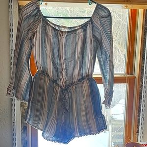 Gorgeous long sleeve multi colored romper. Size large made by One The Land